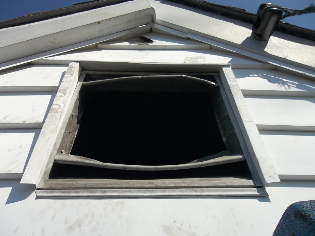 raccoon breaking into attic through gable vent litchfield county connecticut